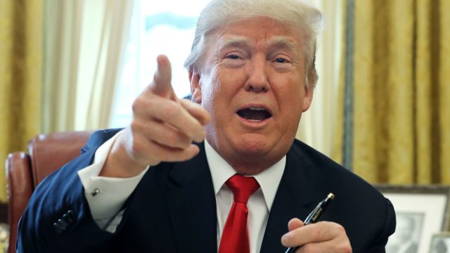 WASHINGTON, DC - DECEMBER 22: U.S. President Donald Trump talks with journalists after signing tax reform legislation into law in the Oval Office December 22, 2017 in Washington, DC. Trump praised Republican leaders in Congress for all their work on the biggest tax overhaul in decades. (Photo by Chip Somodevilla/Getty Images)