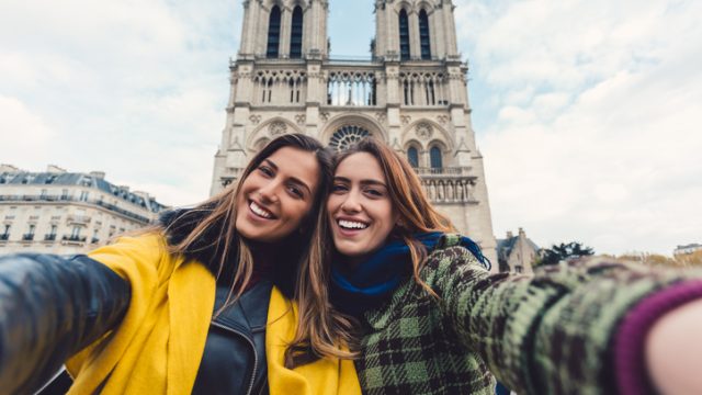 Young women on a vacation in France taking selfie