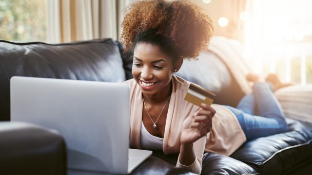Photo of Young Woman Shopping Online