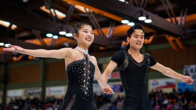 North Korean figure skaters Ryom Tae Ok and Kim Ju Sik react after competing in the Pairs Free Skating during the 2017 Nebelhorn Trophy competition.