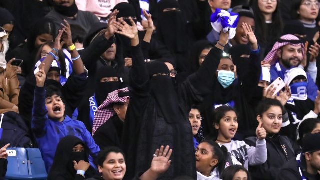 Photo of Female Supporters Cheering at a Saudi Arabian soccer match