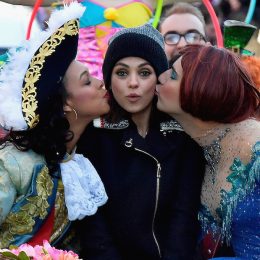 Mila Kunis (C) gets kissed on the cheek at the parade for Hasty Pudding Theatricals' Woman Of The Year on January 25, 2018.
