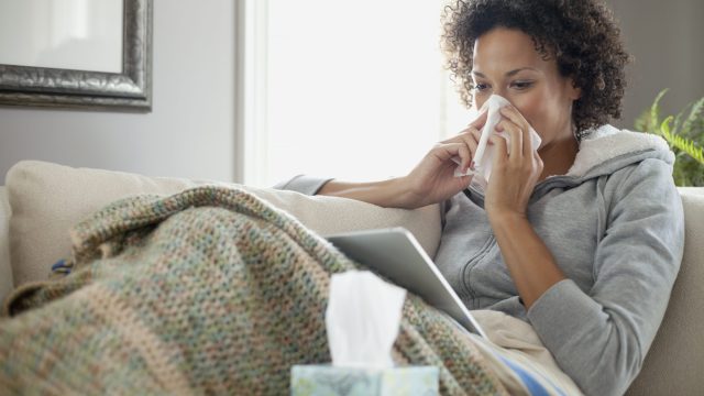 Photo of Woman With the Flu at Home