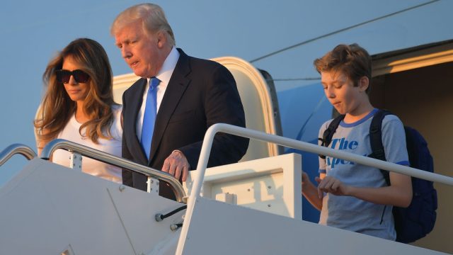 US President Donald Trump (C), first lady Melania Trump, and their son Barron Trump walk off Air Force One after arriving at Andrews Airforce base, Maryland on June 11 2017. Trump is returning to Washington, DC after spending the weekend at this Bedminster, New Jersey golf club. / AFP PHOTO / MANDEL NGAN (Photo credit should read MANDEL NGAN/AFP/Getty Images)