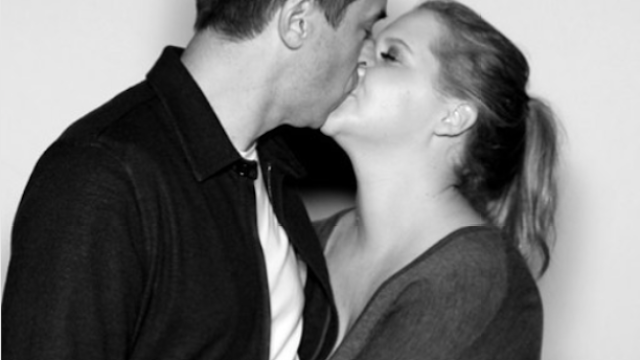 Amy Schumer and Chris Fischer kissing