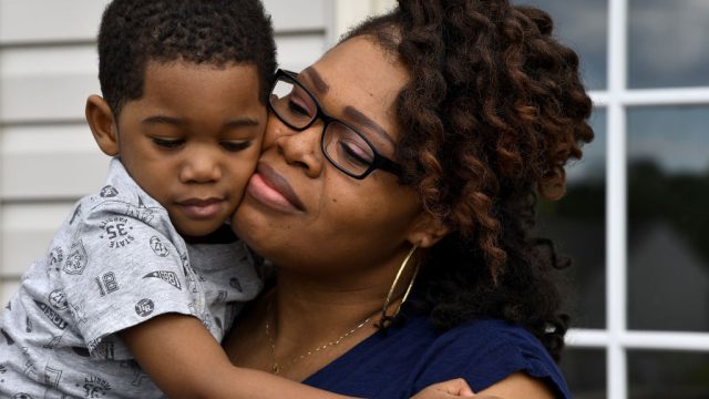DUMFRIES , VA - MAY 26: Keisha Carney comforts Malik, who was not feeling well May 26, 2017 in Dumfries , VA. Keisha Carney had Essure implanted by a doctor in the hospital after a few months after her twins were born, but found out in May 2015 that she was pregnant. (Photo by Katherine Frey/The Washington Post via Getty Images)