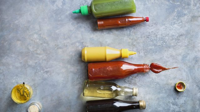 Man drinks bottle of ketchup