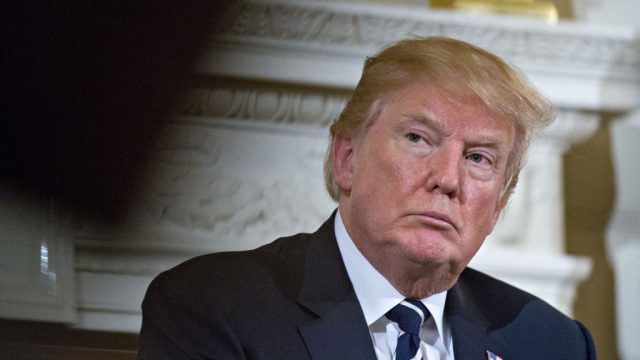 U.S. President Donald Trump participates in a listening session on gun violence with high school students, teachers and parents in the State Dining Room of the White House in Washington, D.C., U.S., on Wednesday, Feb. 21, 2018. Trump promised on Wednesday to act quickly to prevent more school shootings as often-tearful, occasionally angry survivors and parents of victims poured out their frustration to him in a remarkable White House meeting. Photographer: Andrew Harrer/Bloomberg via Getty Images