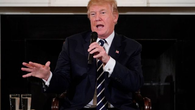 rump floated the idea of arming teachers and promised more stringent background checks on gun owners as he hosted an emotional meeting Wednesday with students who survived last week's mass shooting at a Florida school. / AFP PHOTO / MANDEL NGAN (Photo credit should read MANDEL NGAN/AFP/Getty Images)