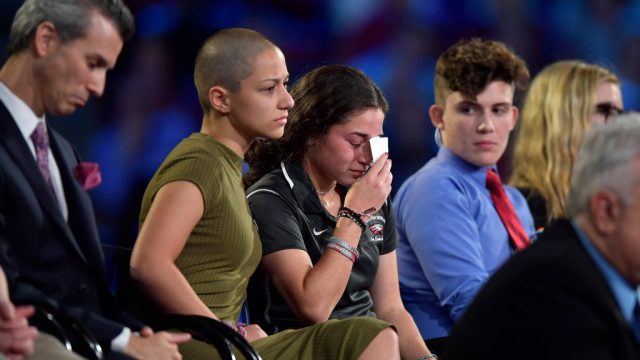Marjory Stoneman Douglas High School student Emma Gonzalez comforts a classmate during a CNN town hall meeting on Wednesday, Feb. 21, 2018, at the BB&T Center, in Sunrise, Fla