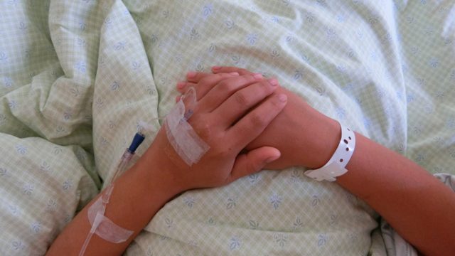 Woman on hospital bed