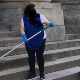 Woman scrubbing "Happy International Women's Day" off steps is going viral.
