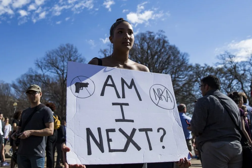 gun protest sign