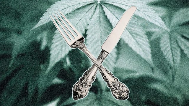 Fork and knife on top of marijuana leaves