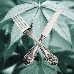 Fork and knife on top of marijuana leaves