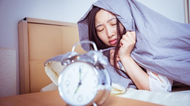 Sleepy young woman in the morning