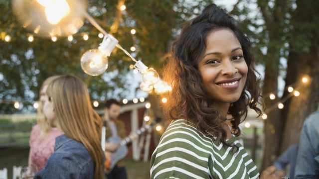 Portrait of smiling woman at outdoor party