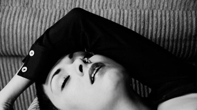 Image of a woman with her eyes closed