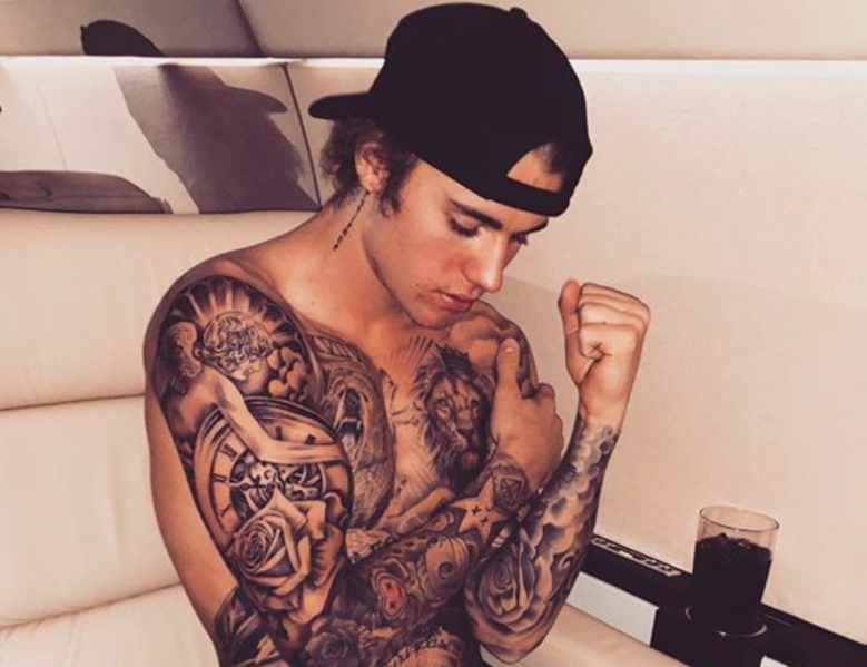 Justin Bieber sends fans wild after displaying tattooed torso in arty  shirtless snap | The Sun