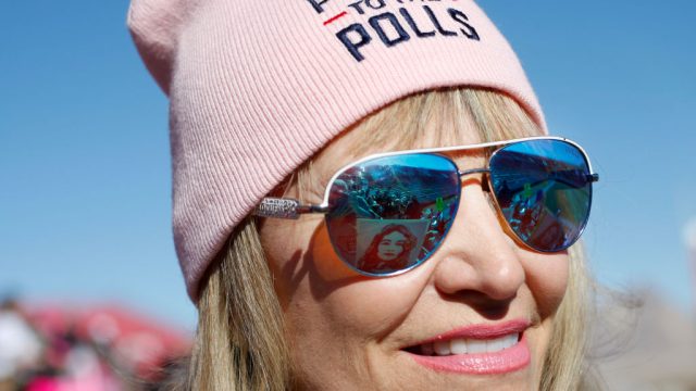 LAS VEGAS, NV - JANUARY 21: Carol Barber Terkhorn waits for the start of the Women's March "Power to the Polls" voter registration tour launch at Sam Boyd Stadium on January 21, 2018, in Las Vegas, Nevada. Demonstrators across the nation gathered over the weekend, one year after the historic Women's March on Washington, D.C., to protest President Donald Trump's administration and to raise awareness for women's issues. (Photo by Sam Morris/Getty Images)