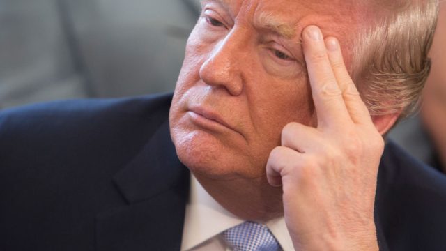 WASHINGTON, DC - APRIL 11: US President Donald Trump listens to victims stories before signing H.R. 1865, the "Allow States and Victims to Fight Online Sex Trafficking Act of 2017" at The White House in Washington, DC, April 11, 2018. (Photo by Chris Kleponis-Pool/Getty Images)