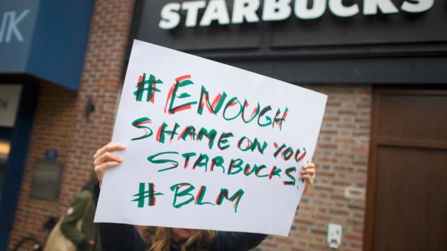Protestors demonstrate outside a Starbucks on April 15, 2018 in Philadelphia, Pennsylvania.