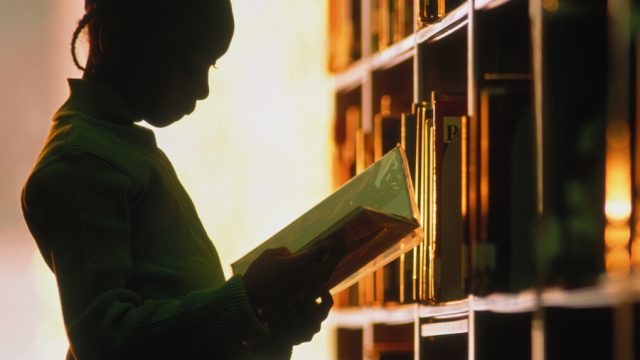 Silhouette of girl in library