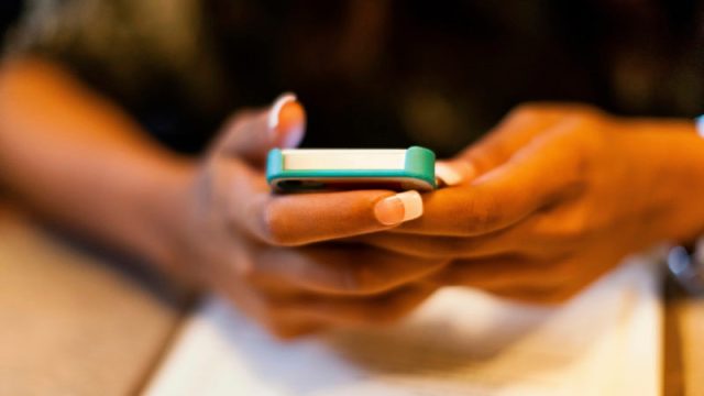 Close up of woman using cell phone