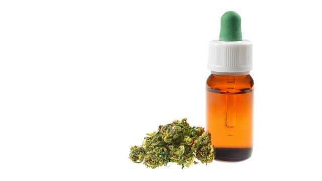 Marijuana oil cbd bottle isolated on white background