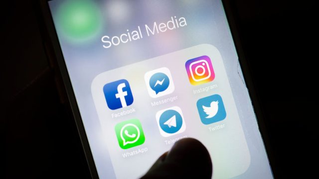 Berlin, Germany - February 12: In this photo illustration the apps of social media networks WhatsApp, Facebook, Instagram, Twitter, Telegram, Messenger are displayed on a smartphone on