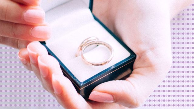 Woman holding an engagement ring box