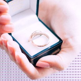 Woman holding an engagement ring box