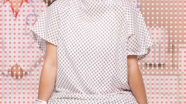 Woman in hospital gown