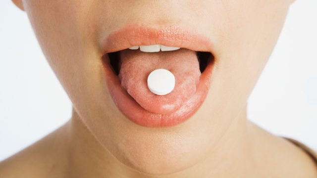 Pill on a tongue