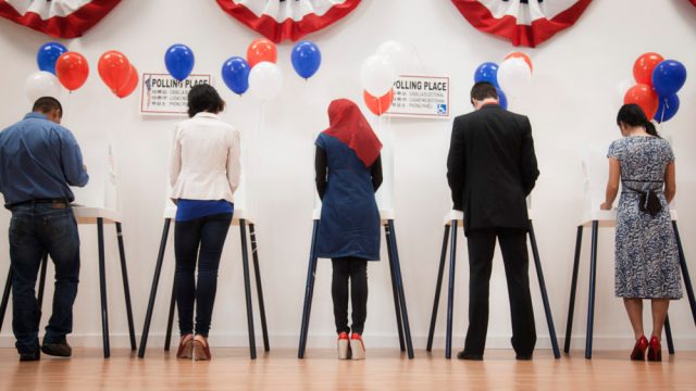Voters voting in polling place