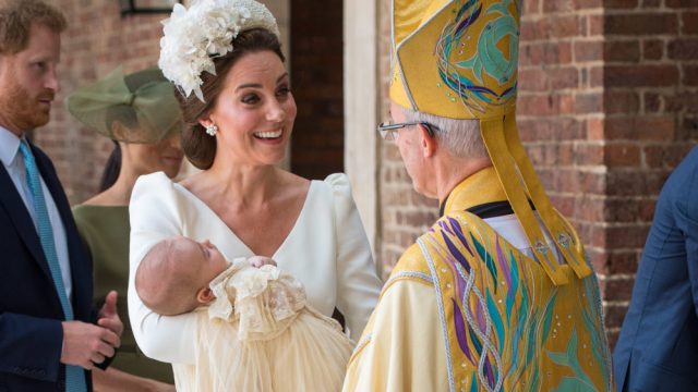 Britain's Catherine, Duchess of Cambridge holds Britain's Prince Louis of Cambridge as she speaks to Archbishop of Canterbury, Justin Welby (R) on their arrival for his christening service at the Chapel Royal, St James's Palace, London on July 9, 2018.
