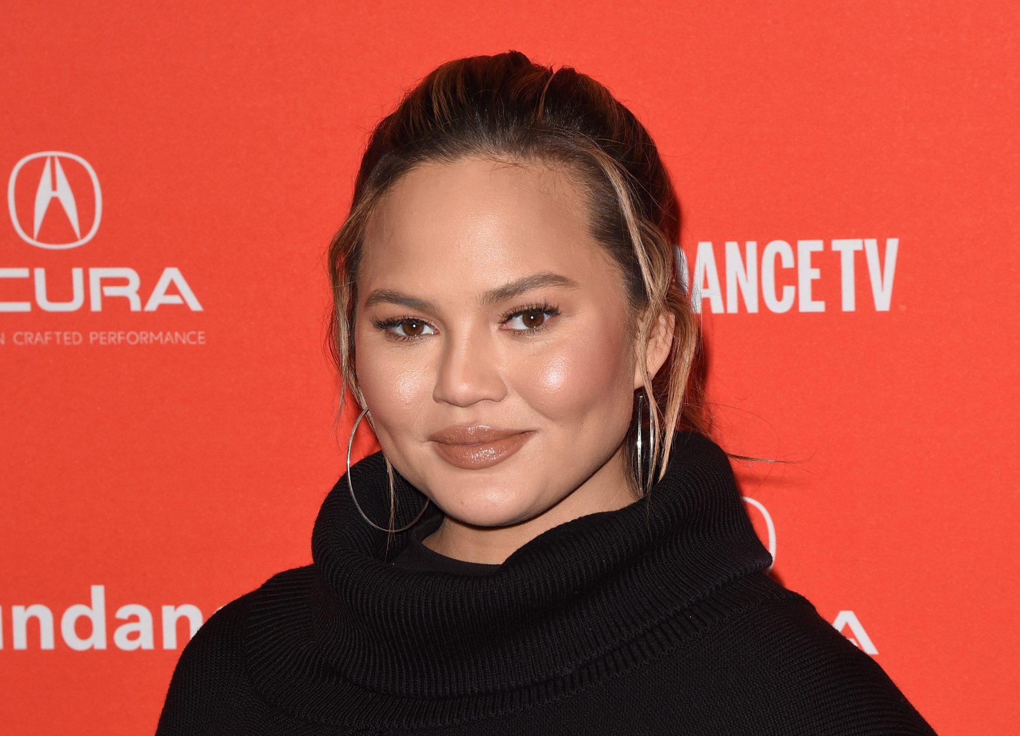 Chrissy Teigen Slams Paparazzi Who Photographed Her Breast