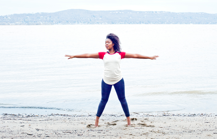 Black woman practicing yoga