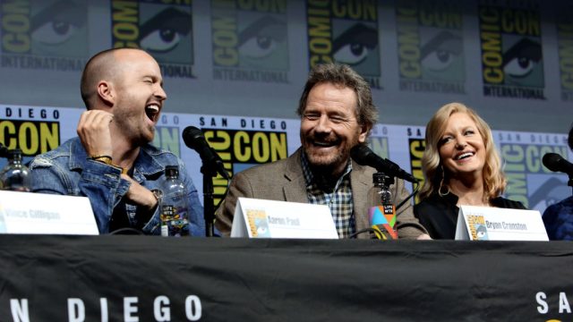 SAN DIEGO, CA - JULY 19: (L-R) Aaron Paul, Bryan Cranston and Anna Gunn speak onstage during the "Breaking Bad" 10th Anniversary Celebration during Comic-Con International 2018 at San Diego Convention Center on July 19, 2018 in San Diego, California.