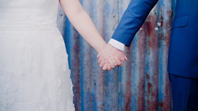 Couple holding hands