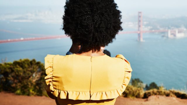 Rear image of woman looking at Golden Gate Bridge