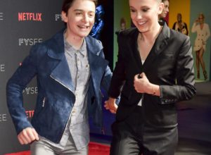 LOS ANGELES, CA - MAY 19: Actress Millie Bobby Brown (R) and Noah Schnapp arrive at the #NETFLIXFYSEE event for "Stranger Things" at Netflix FYSEE at Raleigh Studios on May 19, 2018 in Los Angeles, California.