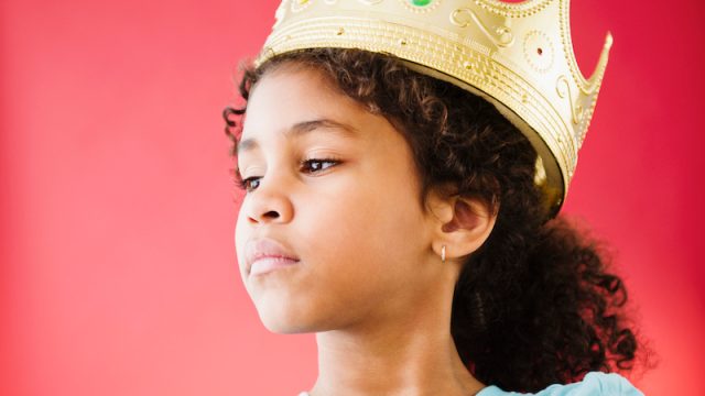 Girl wearing a play crown