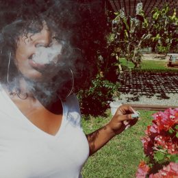 Young Black woman smoking marijuana