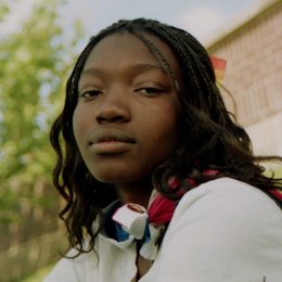 Young Black woman looking at camera
