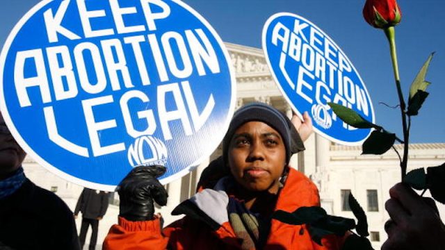 Pro-choice activist Lisa King protests in front of the Supreme Court.