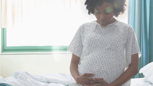 Pregnant woman on a hospital bed