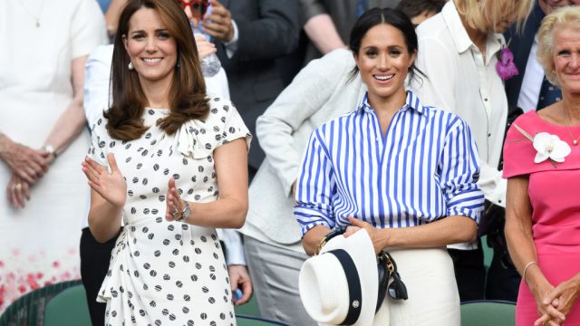 LONDON, ENGLAND - JULY 14: Catherine, Duchess of Cambridge and Meghan, Duchess of Sussex attend day twelve of the Wimbledon Tennis Championships at the All England Lawn Tennis and Croquet Club on July 14, 2018 in London, England.