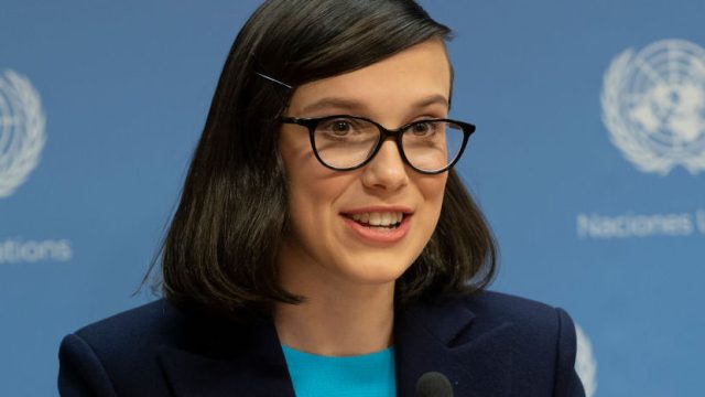UN HEADQUARTERS, NEW YORK, UNITED STATES - 2018/11/20: Millie Bobby Brown wearing dress by Emilia Wickstead & coat by Altuzarra speaks during press briefing & appointment as UNICEF Goodwill Ambassador at UN Headquarters.