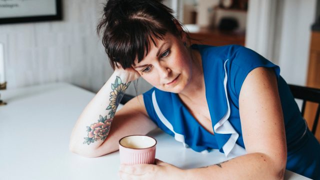 Woman sad at the dinner table